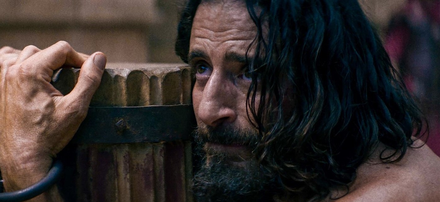 Jonathan Roumie as Jesus, chained at a wooden pillar, in The Chosen Season 6
