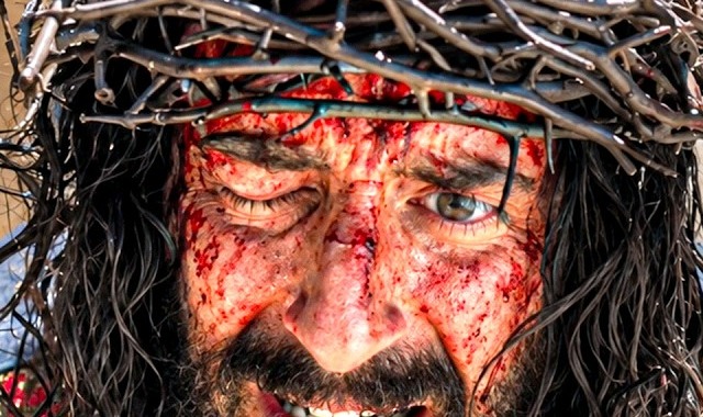Jonathan Roumie as Jesus, blood across his face and forehead, wearing a crown of thorns in The Chosen Season 6