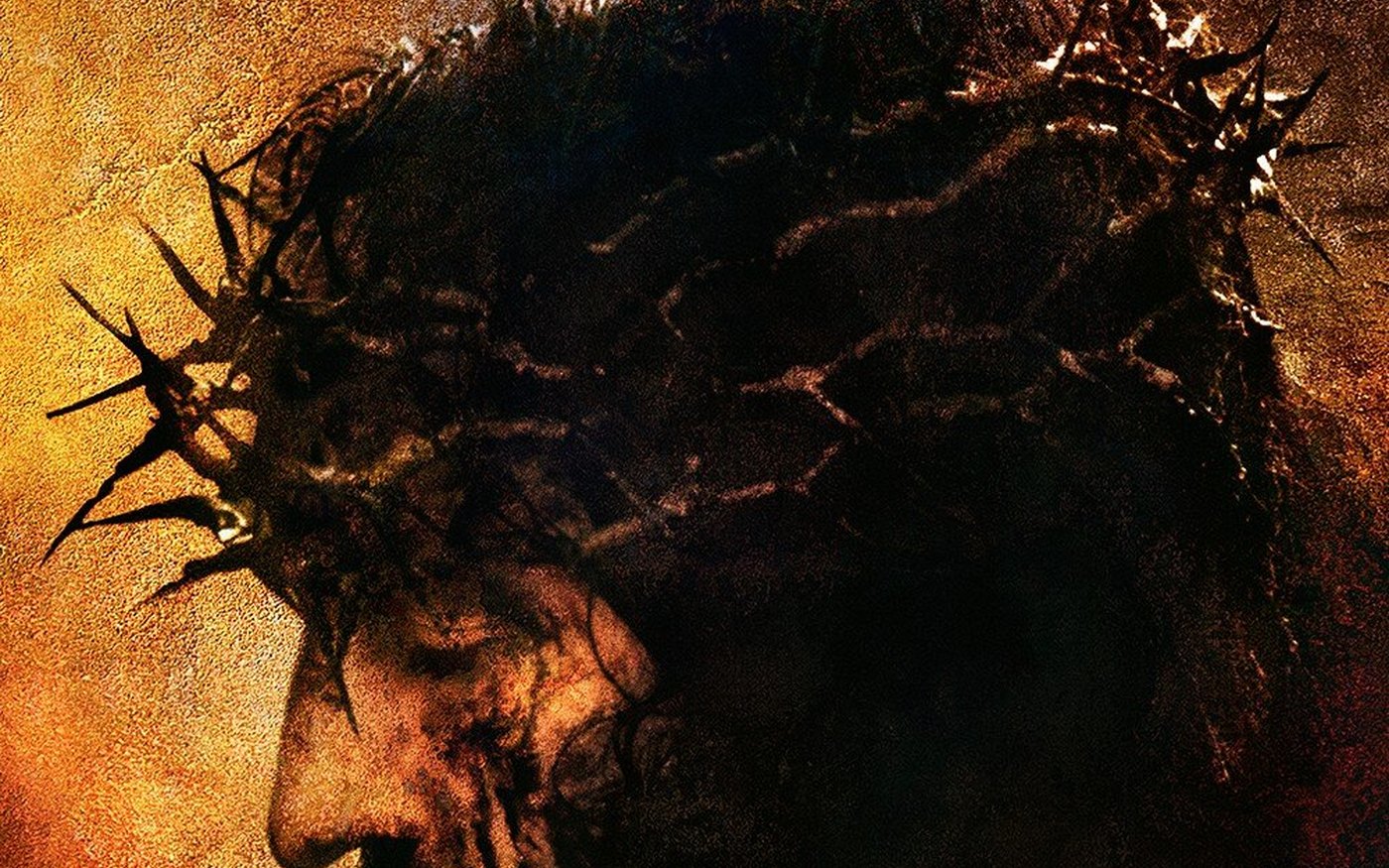 Jim Caviezel in profile as Jesus, wearing the crown of thorns against gold, from the 4K Passion of the Christ restoration